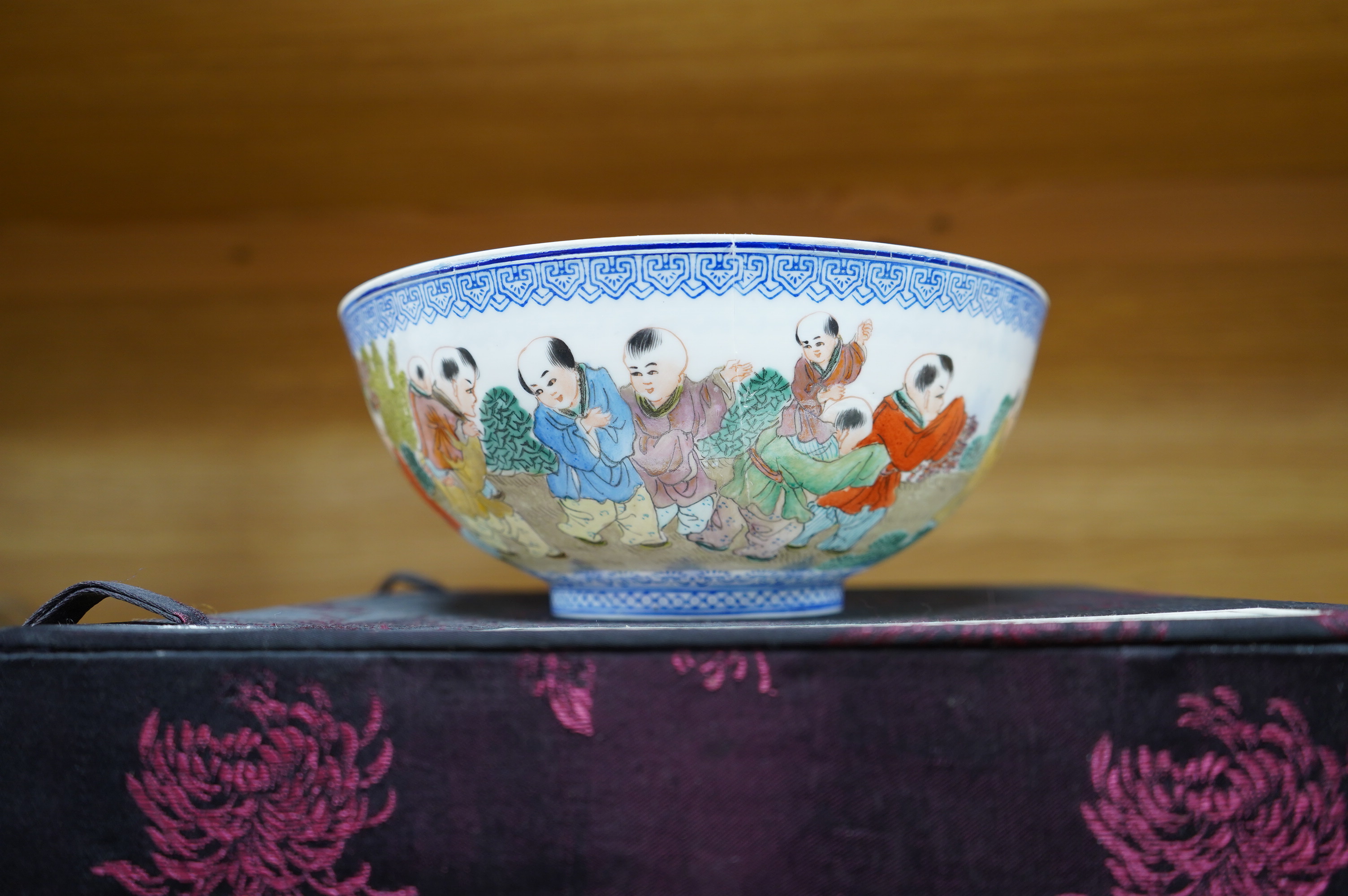 A Chinese eggshell porcelain bowl, 18cm diameter, boxed. Condition - poor, broken and partially repaired